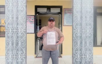 Diduga Rampas Alat Kerja Wartawan, Sekdis Kesehatan Toba Dilaporkan ke Polisi